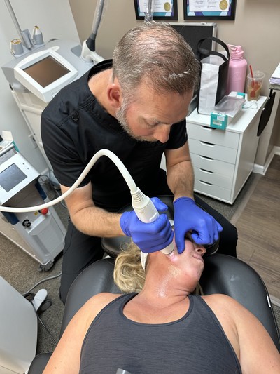 Women getting microneedling on her face